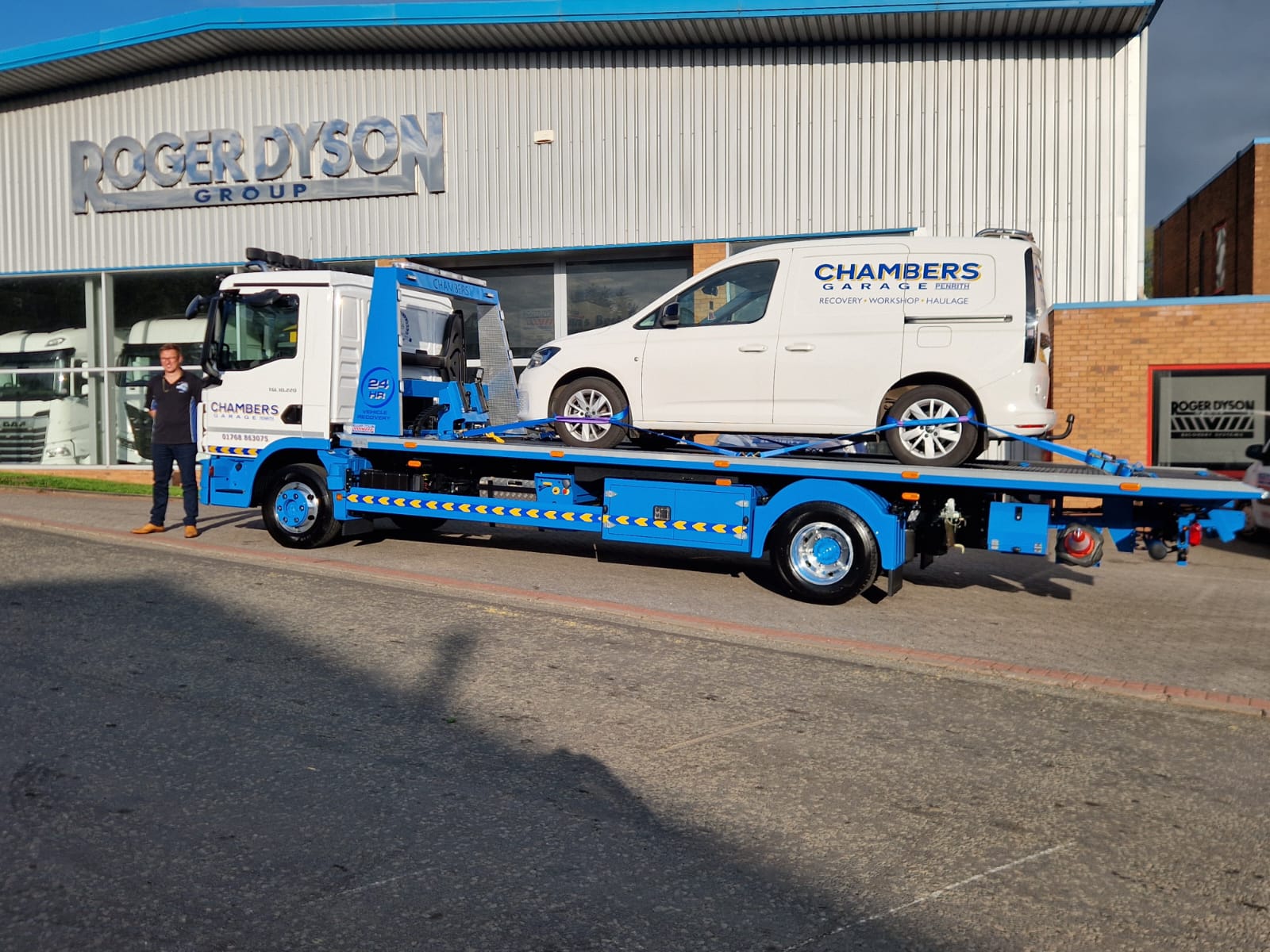 Chambers Garage Hydraloader HR3500 SLA recovery truck carrying a Chambers Garage van outside the Roger Dyson Group building